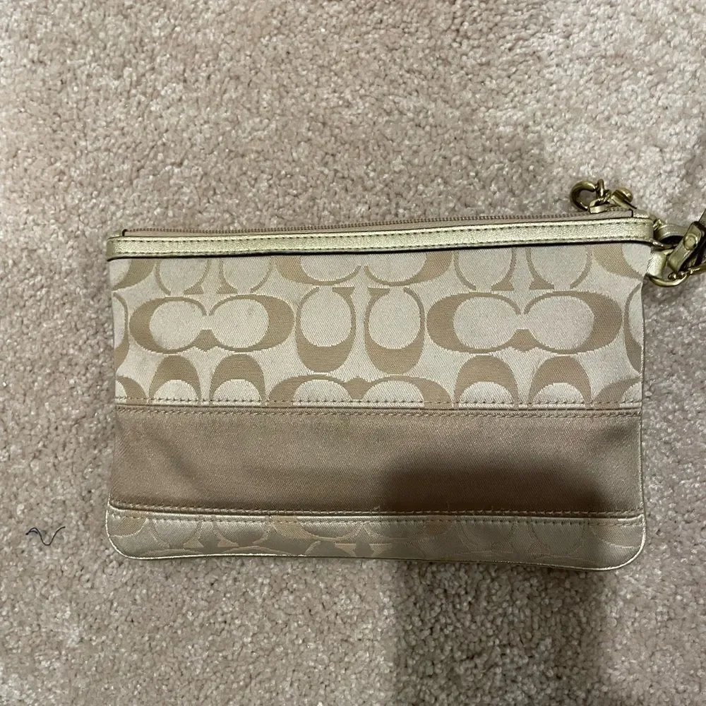 COACH Oversized Gold Wristlet